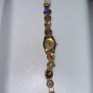 Vintage Avon fashion Wristwatch with gemstone accents and a gold tone chain